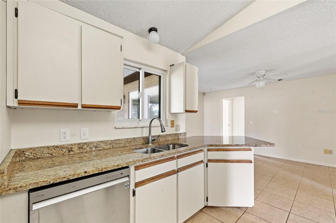 Photo 3 of 20: Kitchen with stainless steel appliances and granite counters.