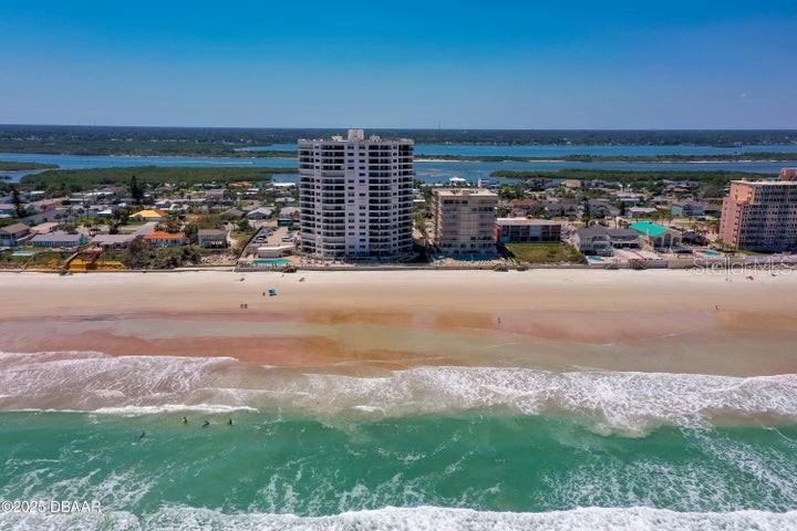 Photo 4 of 20: Nestled directly on the sand, this high-rise building boasts unobstructed beach access and expansive shoreline views—ideal for beachfront living.