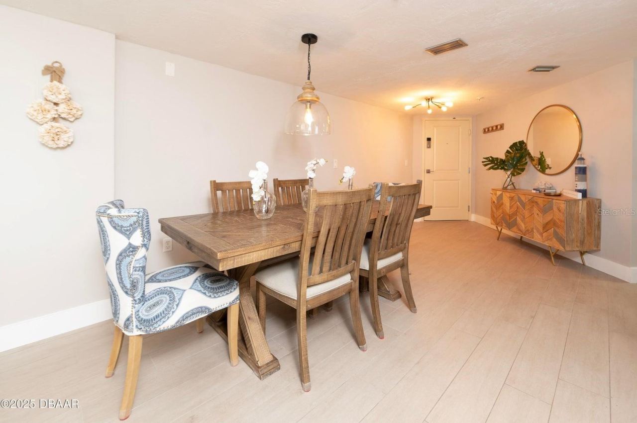 Photo 8 of 20: The spacious dining area offers an inviting setting for meals and entertaining, enhanced by contemporary pendant lighting and a seamless connection to the main living spaces.