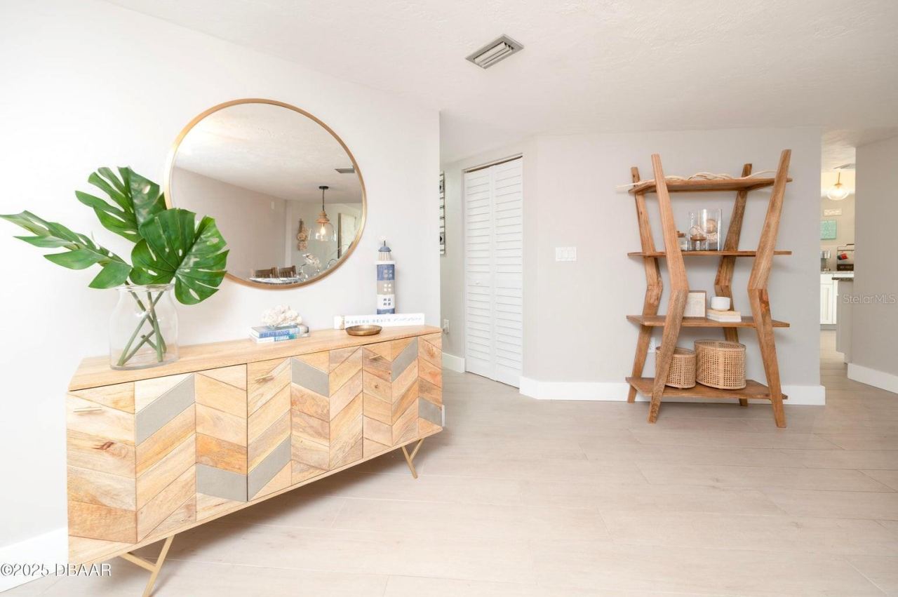 Photo 7 of 20: This bright, coastal-inspired entry features neutral tones, creating an inviting introduction to the residence.