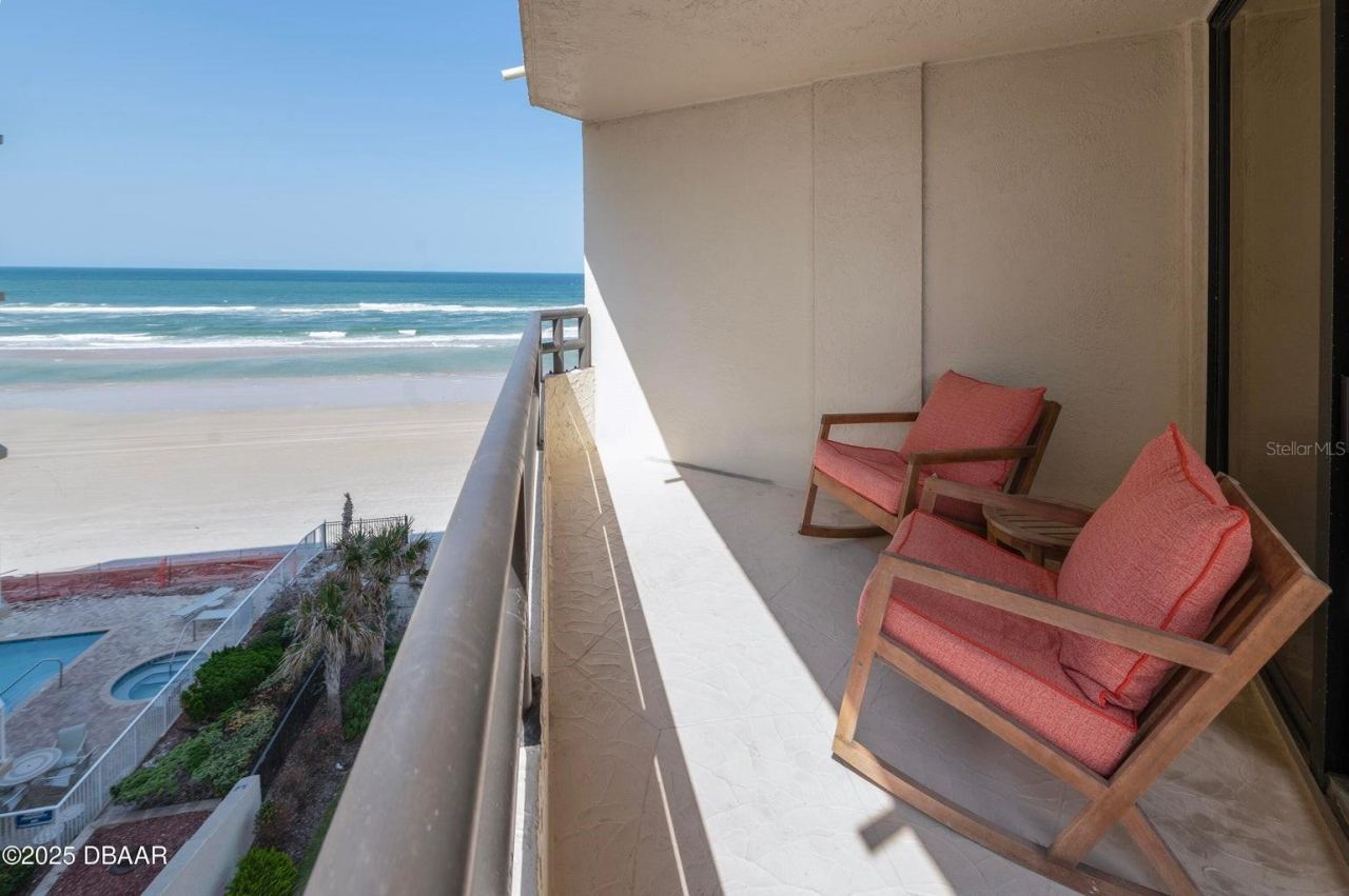 Photo 5 of 20: Ample balcony space with room for seating, overlooking the pool and beach for a true resort-style experience.