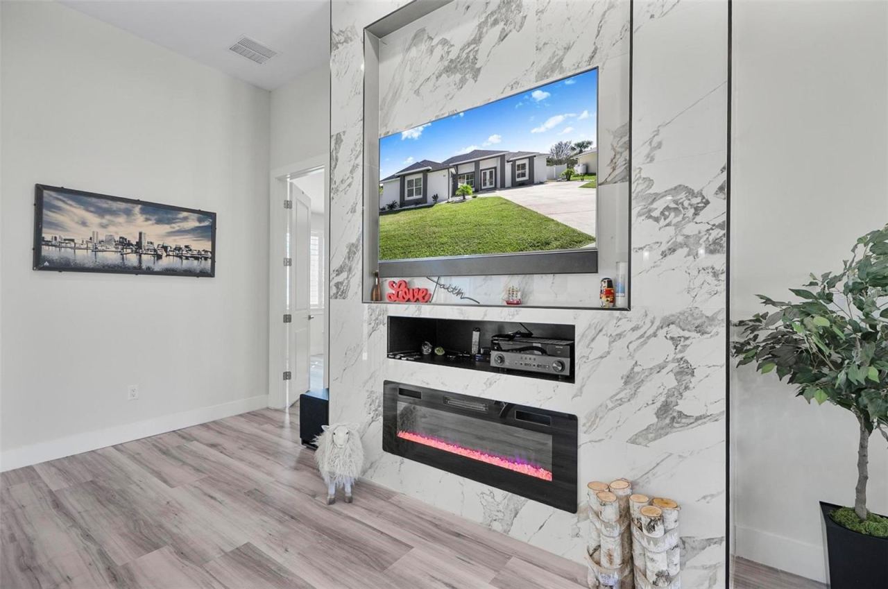 Photo 11 of 20: FIREPLACE IS THE FOCAL FEATURE IN THE MASSIVE LIVING SPACE