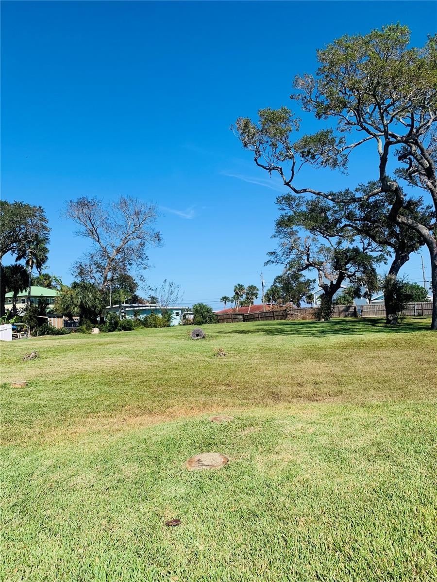 Photo 3 of 7: LOT VIEW FROM WATER'S EDGE