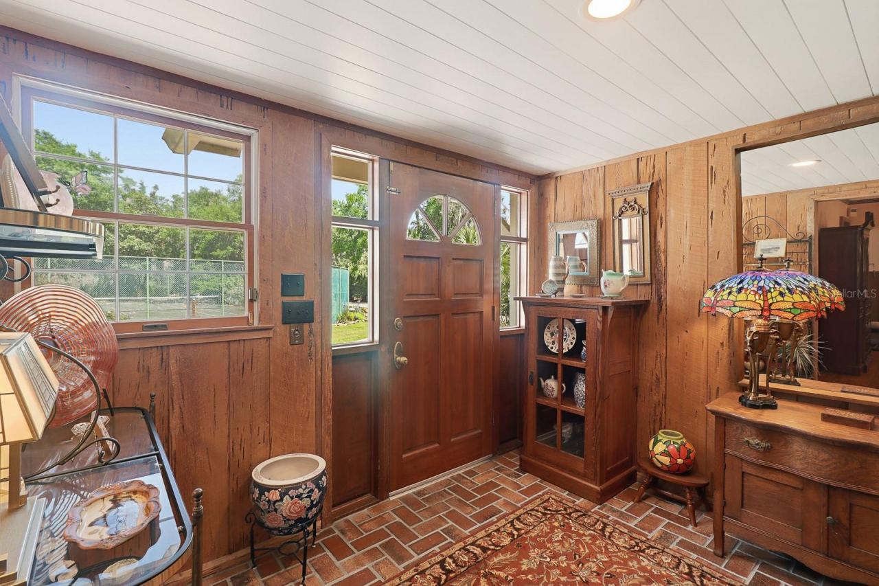 Photo 5 of 20: Foyer with authentic cypress walls and brick floors
