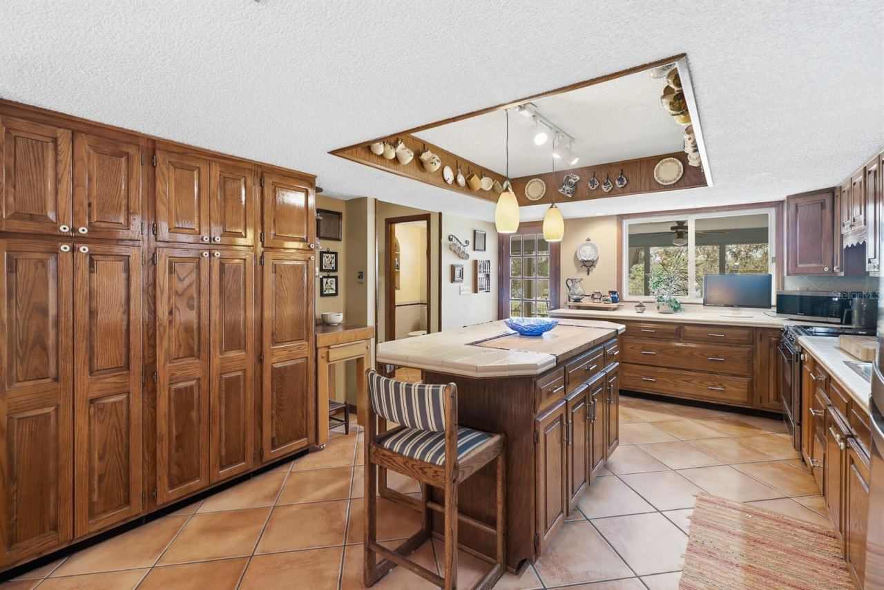 Photo 11 of 20: Timeless wood cabinetry with built in butcher block.