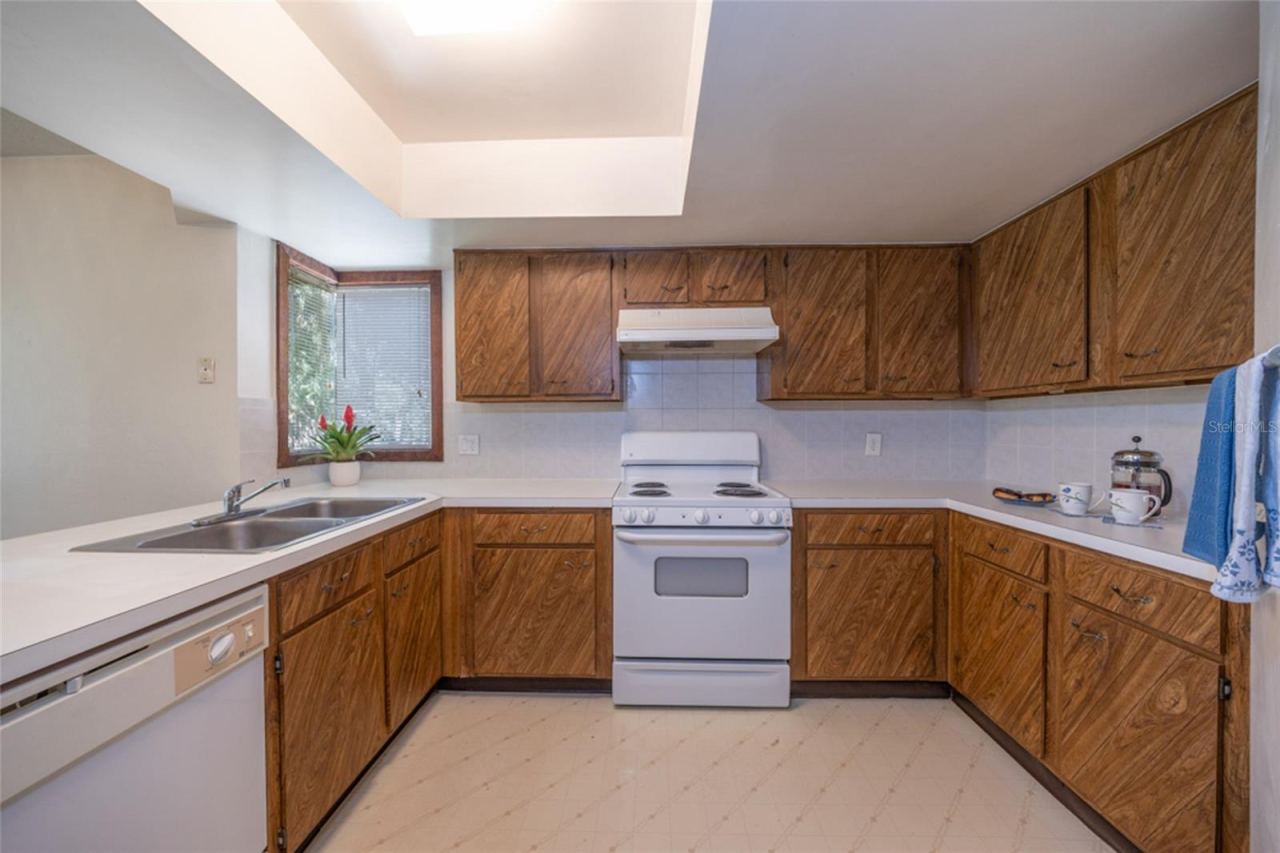 Photo 4 of 20: UNSTAGED: Kitchen With Modern "European Style" Flat Panel Kitchen Doors
