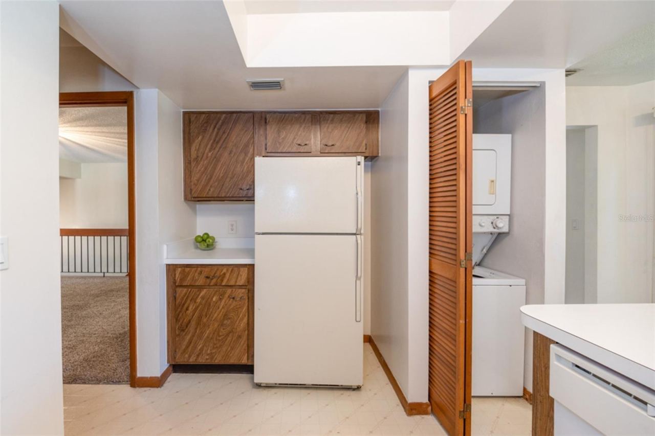 Photo 6 of 20: Laundry Closet In he Kitchen. Stackable Unit Conveys