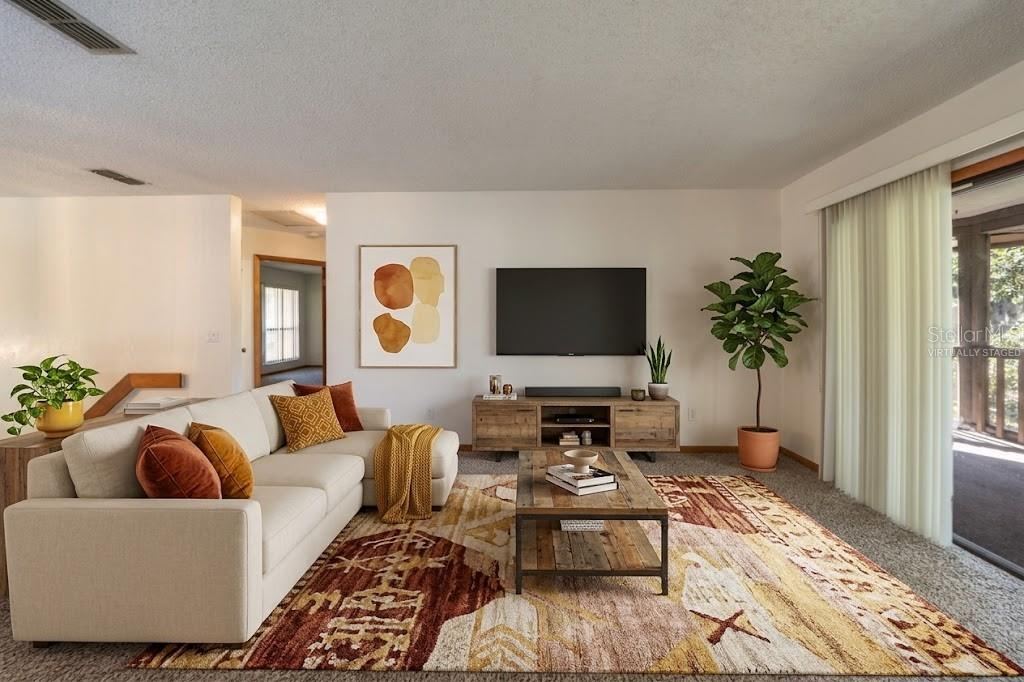 Photo 9 of 20: VIRTUALLY STAGED: Living Area With Sliders That Open Into The Screened Patio