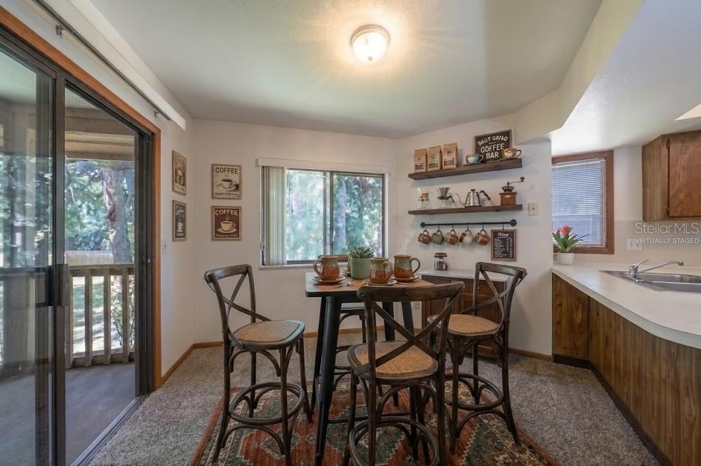 Photo 7 of 20: VIRTUALLY STAGED: Coffee Station/Breakfast Nook Leads Opens To Screened Patio