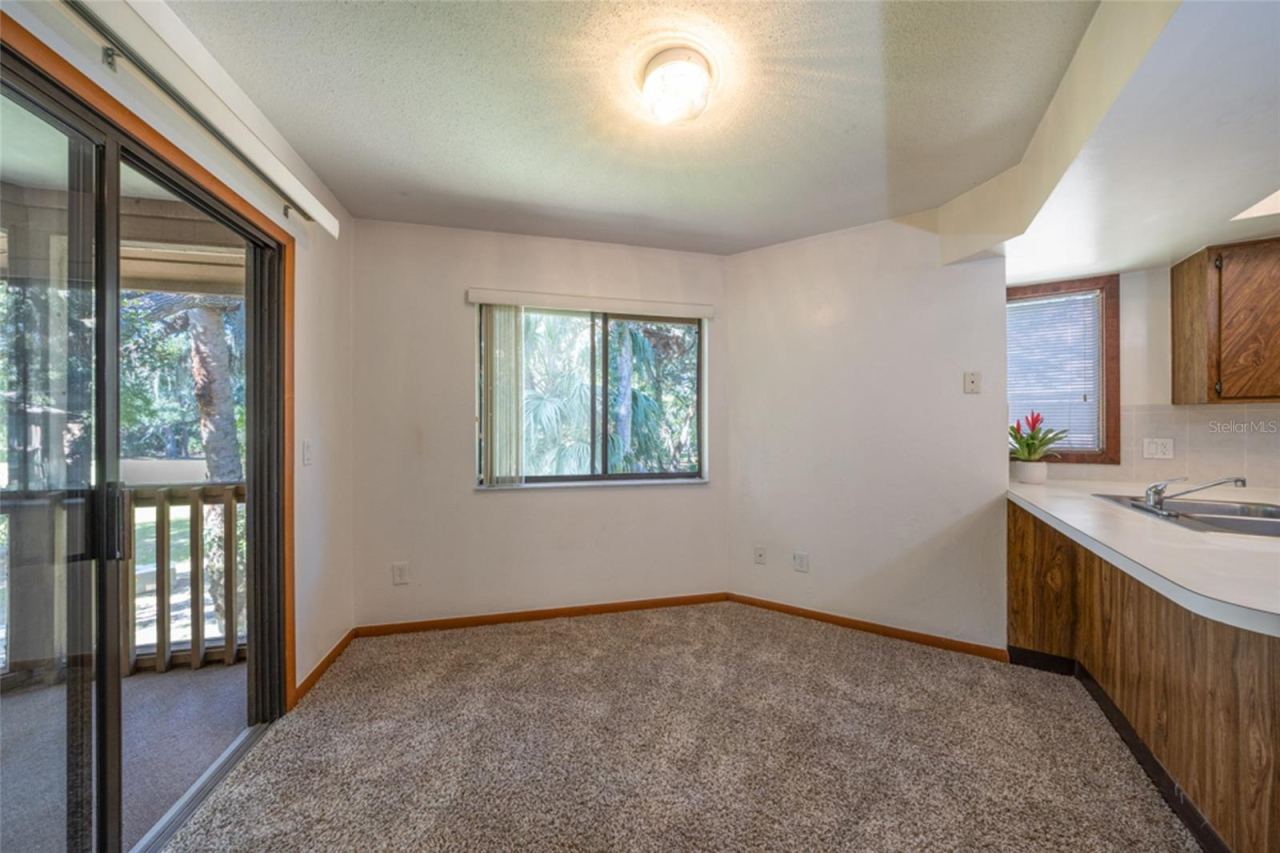 Photo 8 of 20: Sliders From The Breakfast Nook Open To The Screened Patio Overlooking The Golf Course