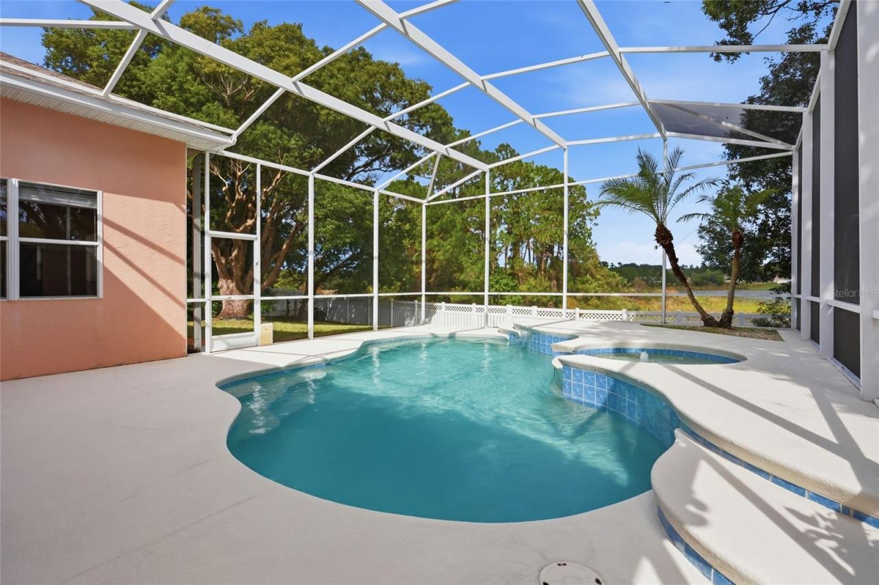 Photo 2 of 20: Screened pool with water views at this Glen Abbey home in DeBary,Florida.