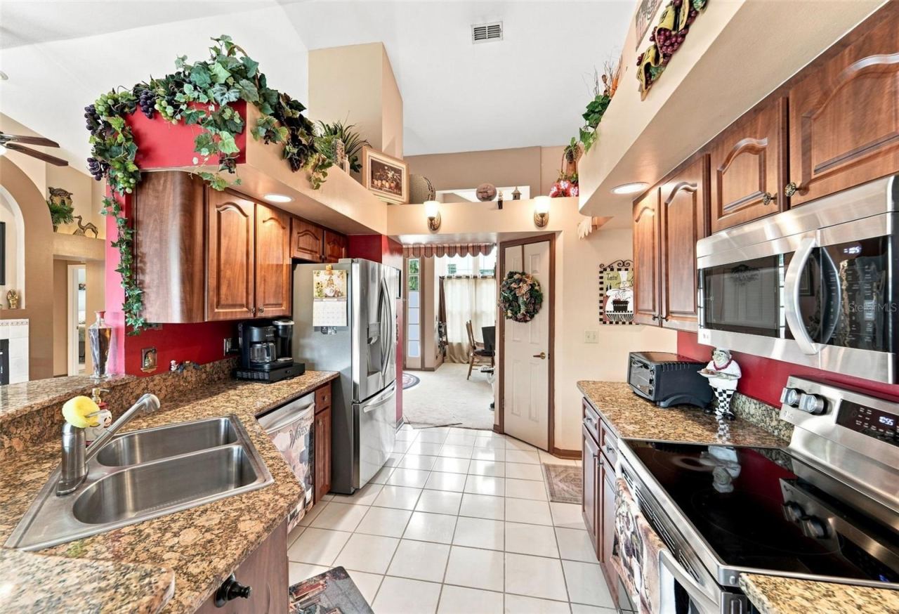 Photo 7 of 20: Abundance of lighting throughout the entire kitchen, you can see the dining room from this angle