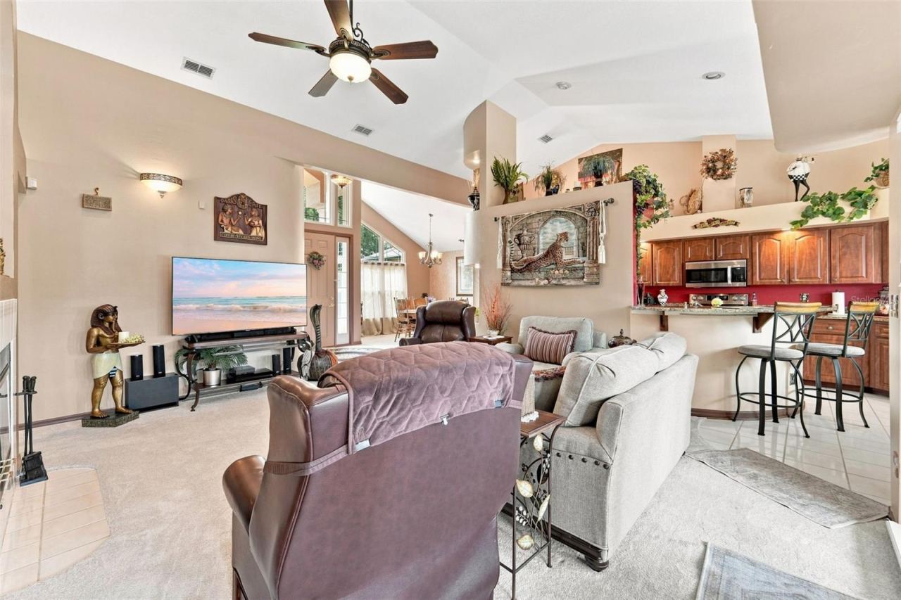 Photo 12 of 20: This angle shows the main living area and kitchen, look at how much natural lighting flows throughout!