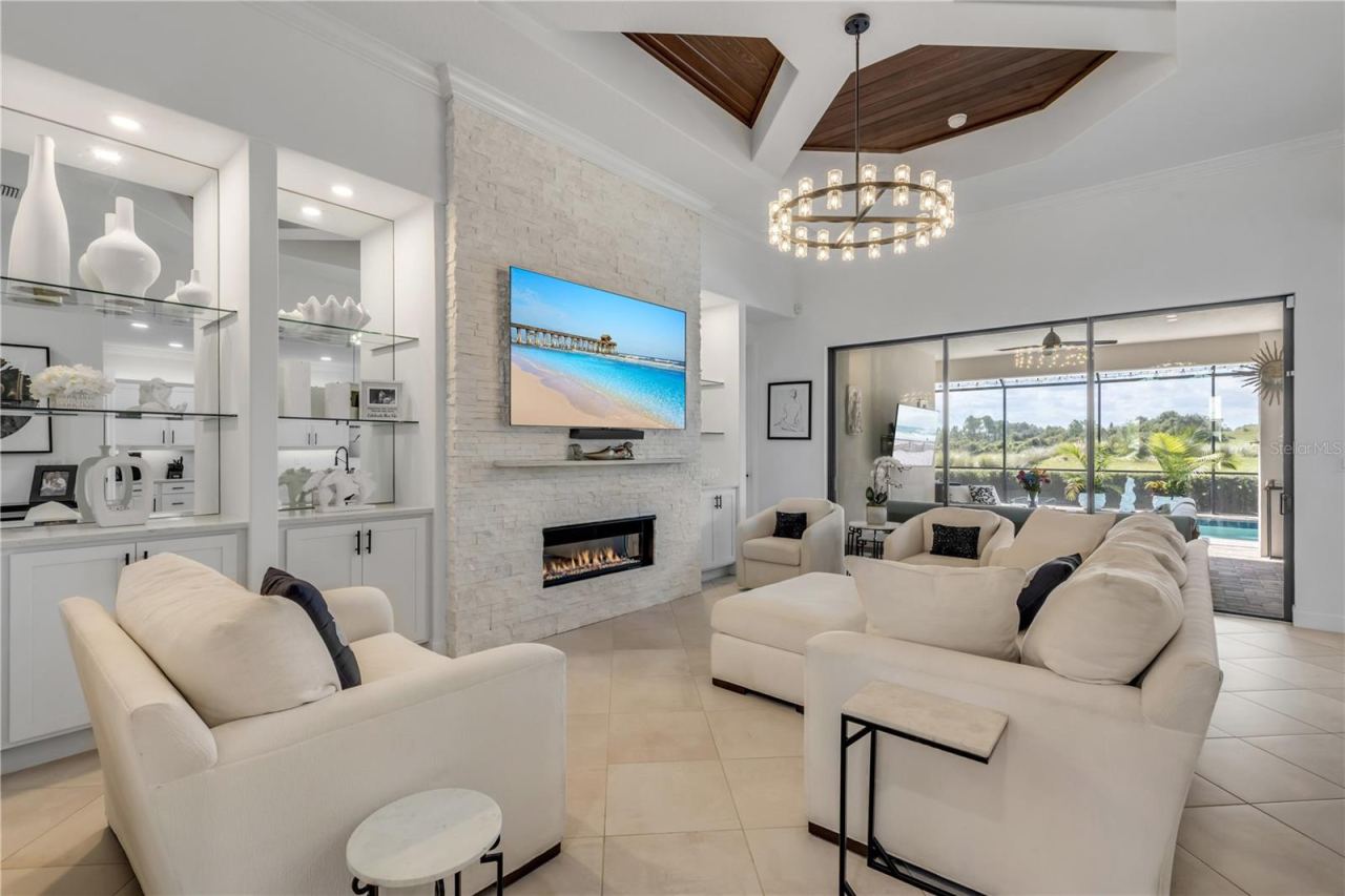 Photo 18 of 20: Gas fireplace with stacked stone surround.