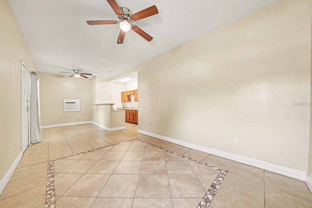 Photo 7 of 20: Open Floor Plan With Tile Details & Kitchen Cabinetry Access