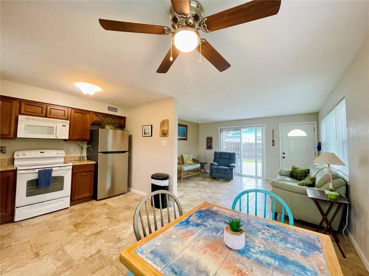 Photo 9 of 20: Multi-angle view of the functional kitchen and dining area, illustrating a fluid connection to the main living space for effortless entertaining.