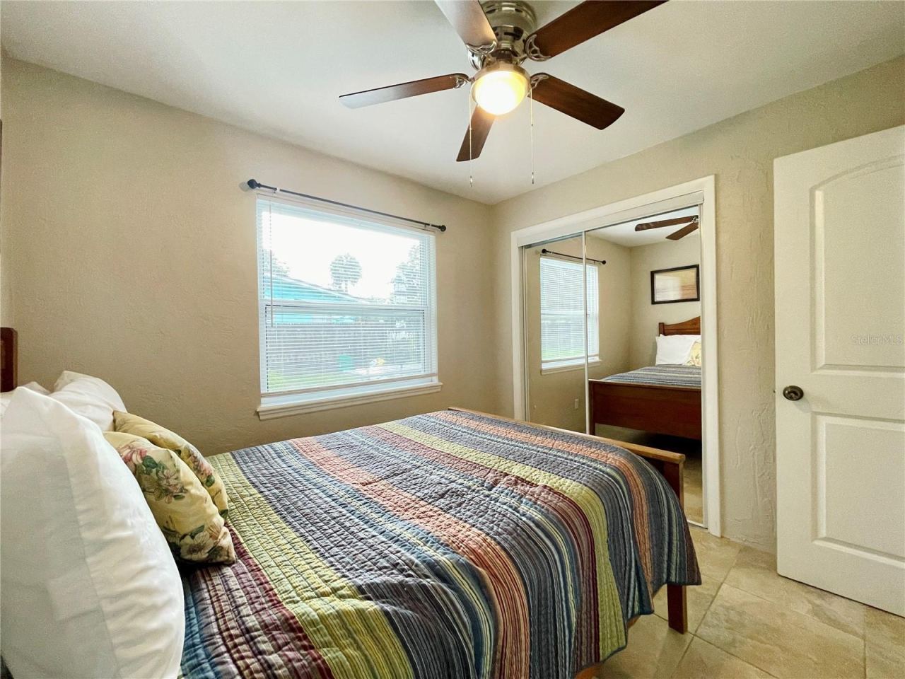 Photo 18 of 20: Another view of the bright bedroom with ample closet space.