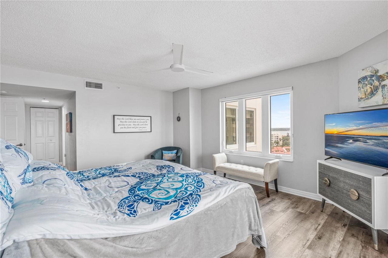 Photo 17 of 20: Primary Bedroom with Triple Window Views