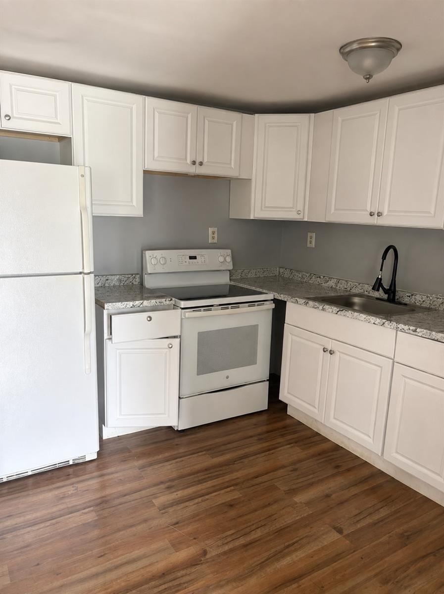 Photo 5 of 15: Kitchen is open to living room