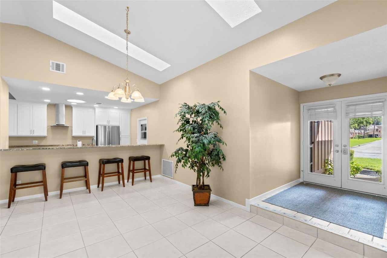 Photo 10 of 20: Entrance to living/dining room and kitchen bar
