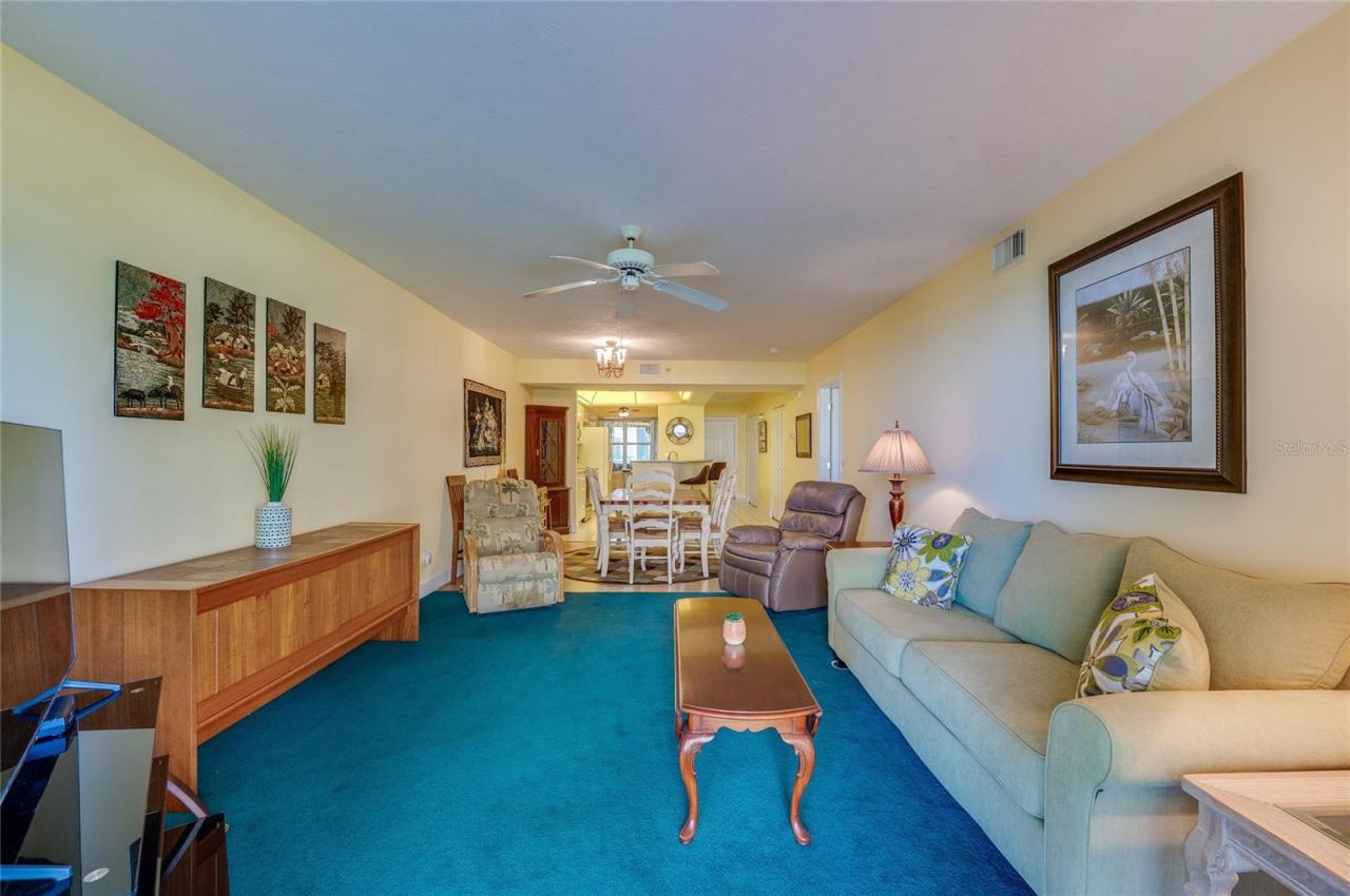 Photo 19 of 20: An open-concept layout connects the living and dining areas, creating a cohesive space perfect for everyday living and gatherings.