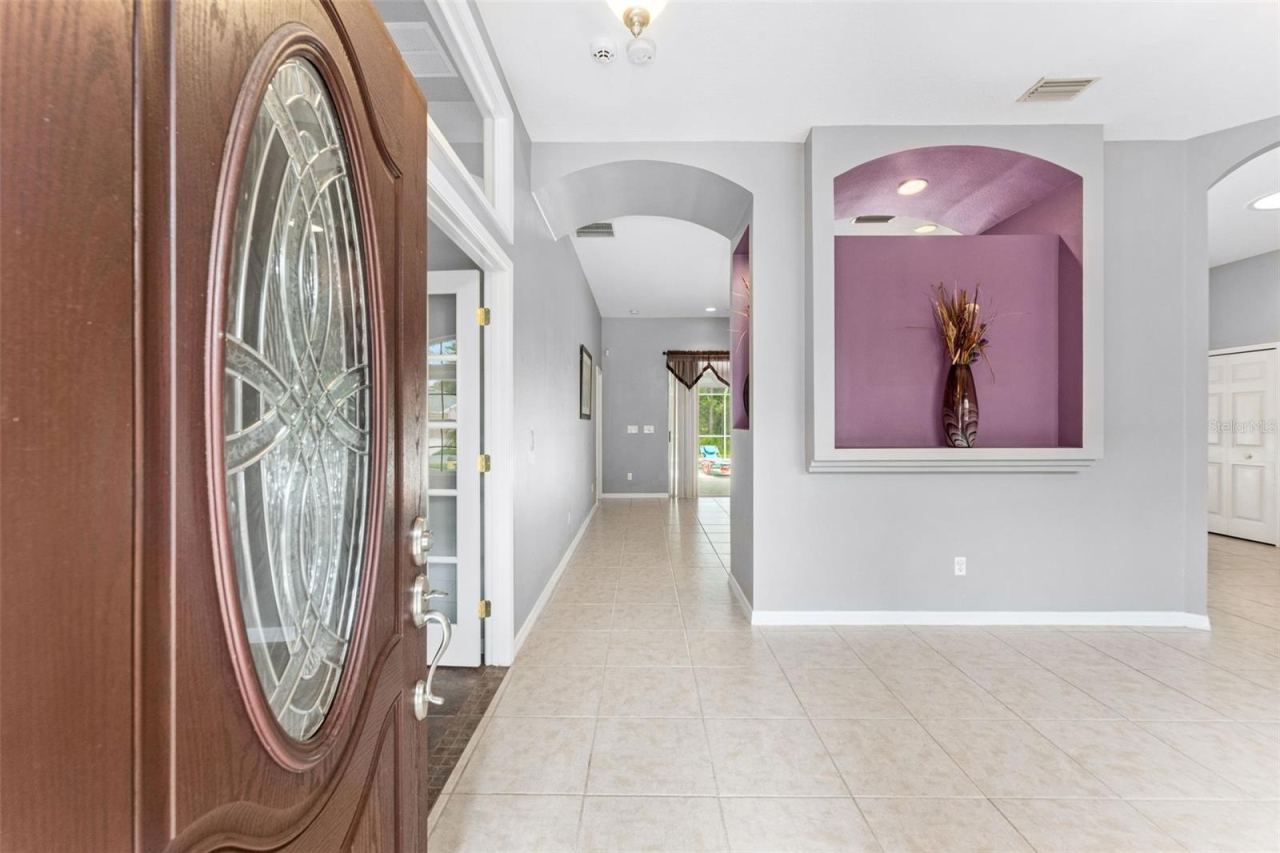 Photo 7 of 20: Foyer to Great Room and Kitchen