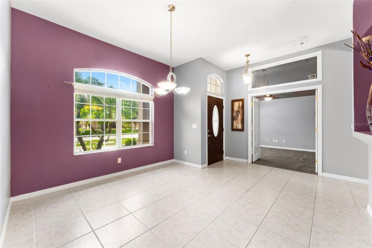 Photo 8 of 20: Formal dining area with view of entry and Bdrm 2.