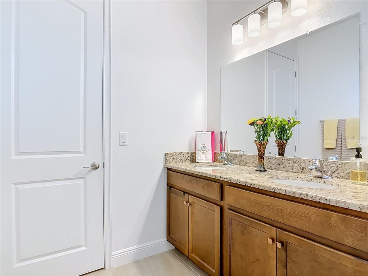 Photo 17 of 20: Primary Bath with closet door from bath