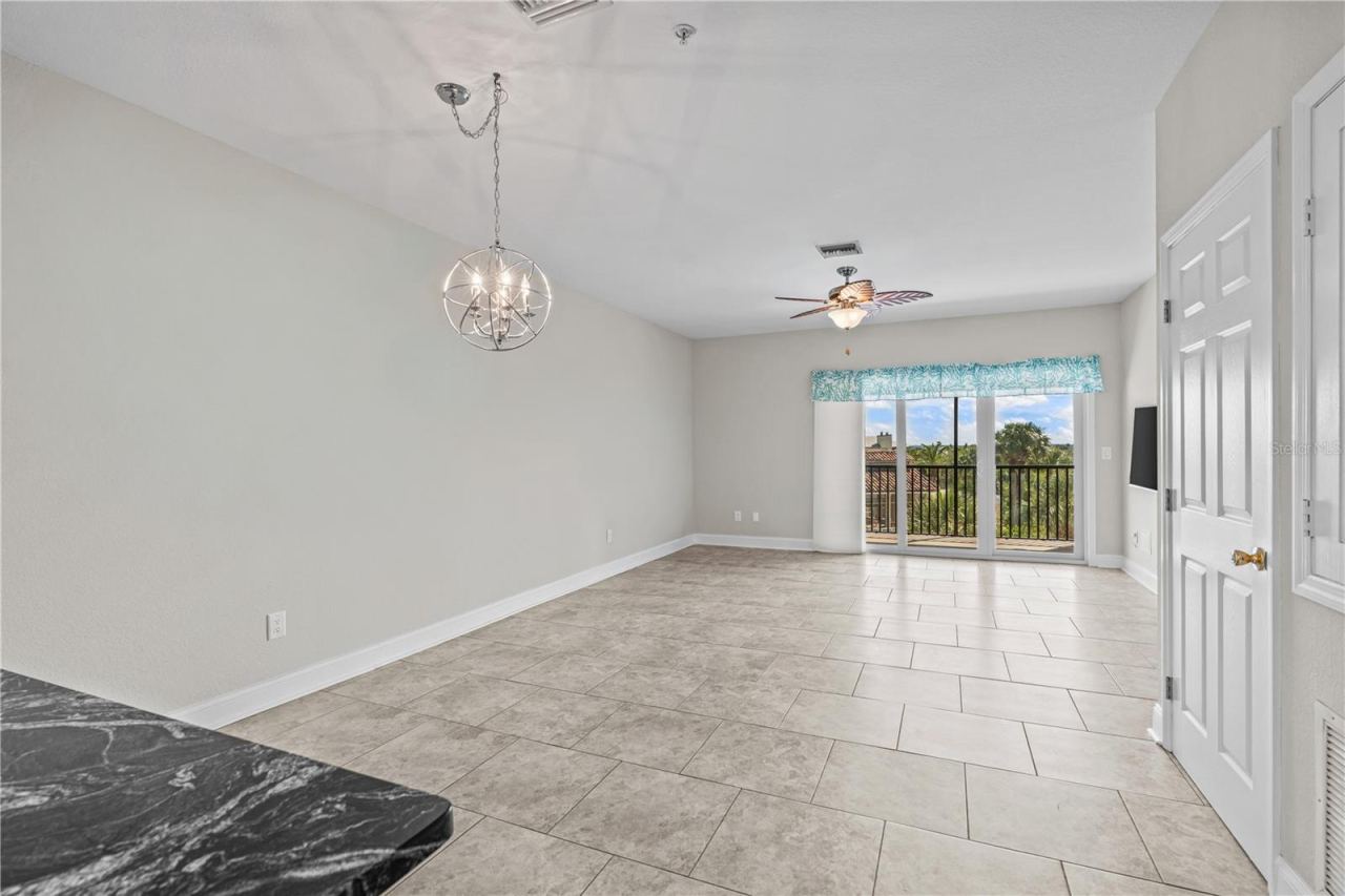 Photo 8 of 20: Living Room w/ Balcony Access