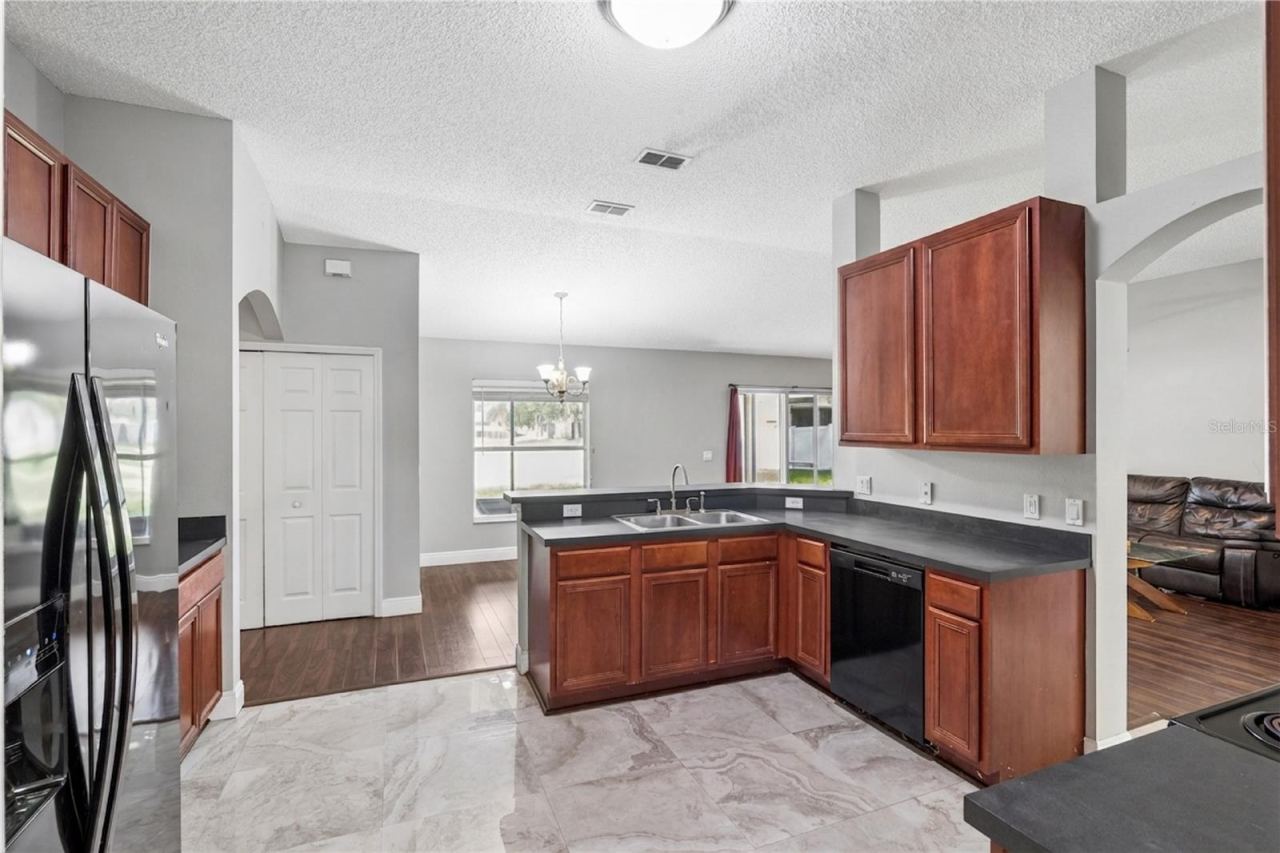 Photo 16 of 20: Large open kitchen with wood cabinets