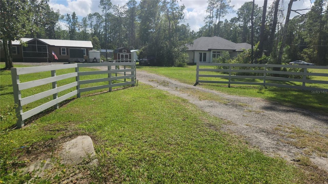 Photo 4 of 20: Entrance to Property. Fence was painted