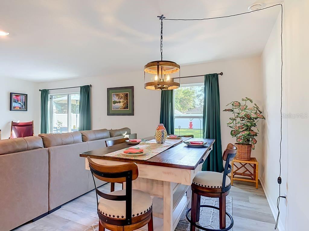 Photo 7 of 20: Dining room - luxury vinyl flooring and large windows for natural lighting