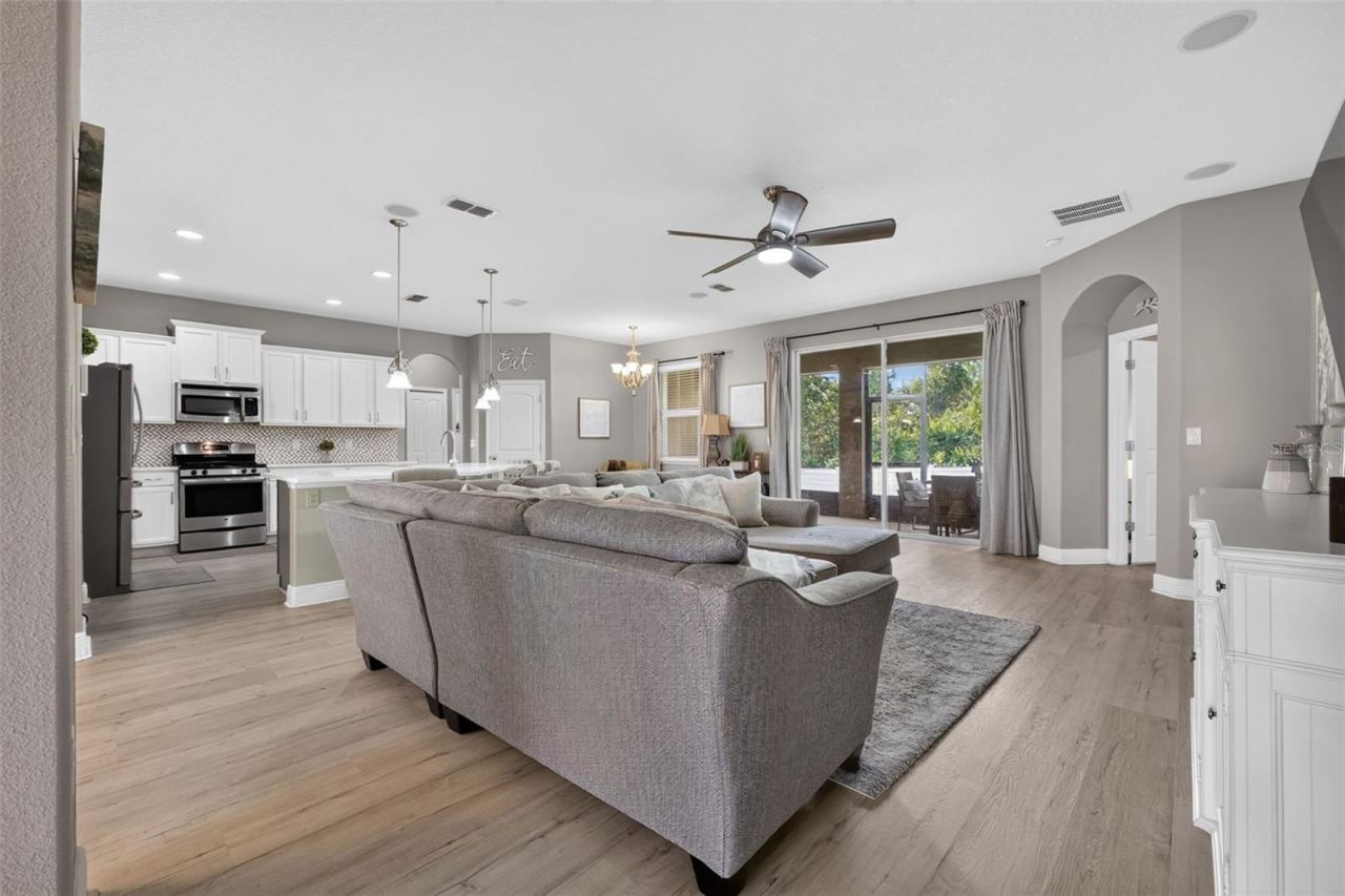 Photo 15 of 20: Open living area towards the screened lanai and kitchen