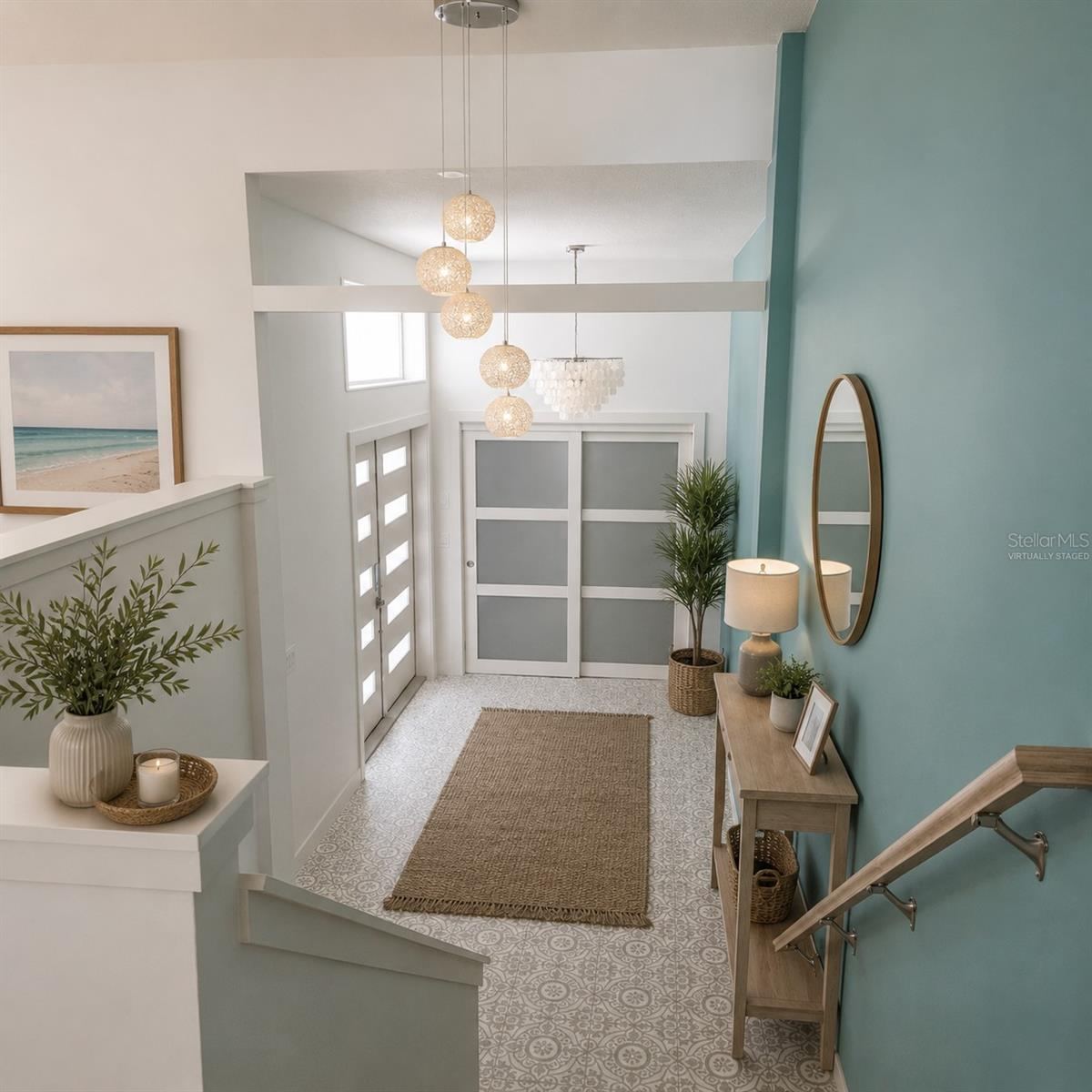 Photo 7 of 20: Virtually Staged. Open foyer with designer tile and a stunning shell chandelier