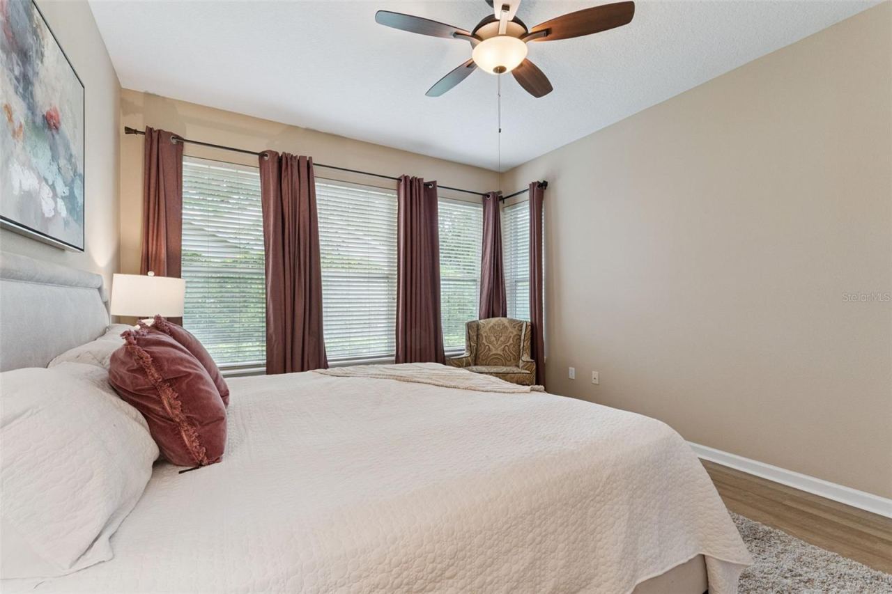 Photo 18 of 20: Primary Bedroom w/ a view to the private backyard