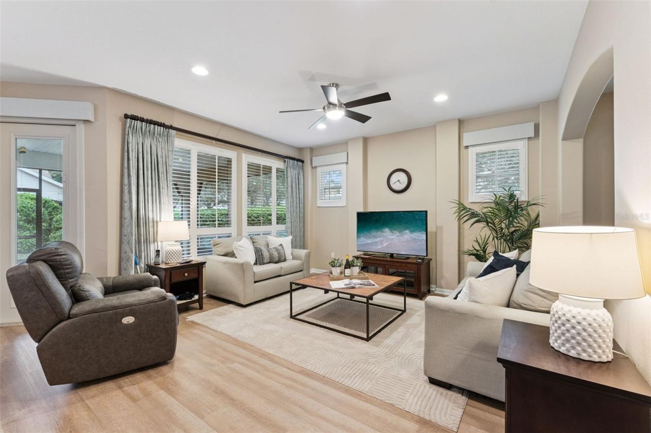 Photo 11 of 20: 13' x 15' Great Room w/ recessed lighting, ceiling fan & Plantation style shutters