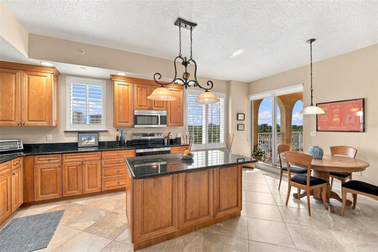 Photo 14 of 20: Eat in kitchen with center island & balcony