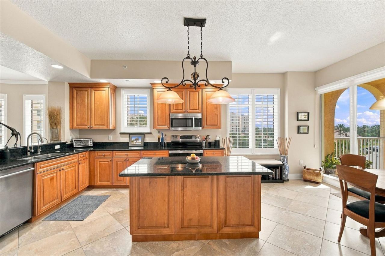 Photo 13 of 20: Kitchen with solid wood cabinetry, granite counters & reverse osmosis drinking water system