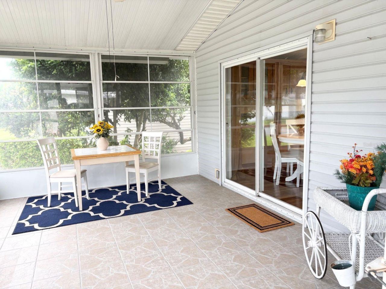 Photo 6 of 20: Vinyl window enclosed porch with slider to kitchen