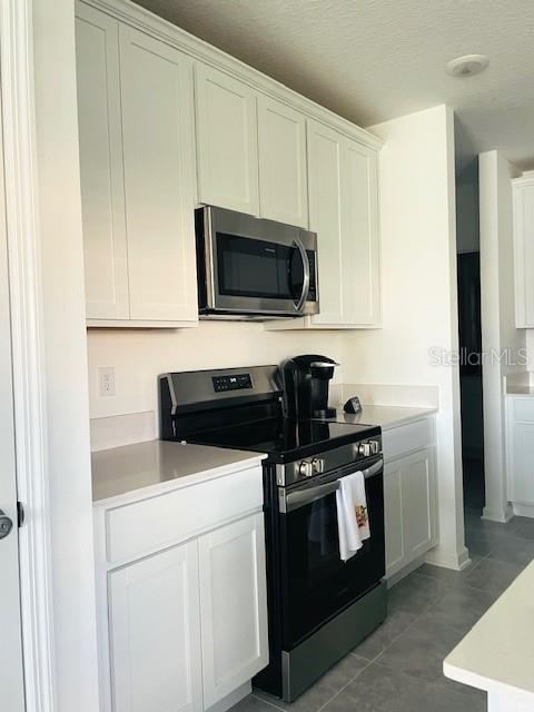 Photo 9 of 20: Beautiful White kitchen Cabinets & front-control Electric Range