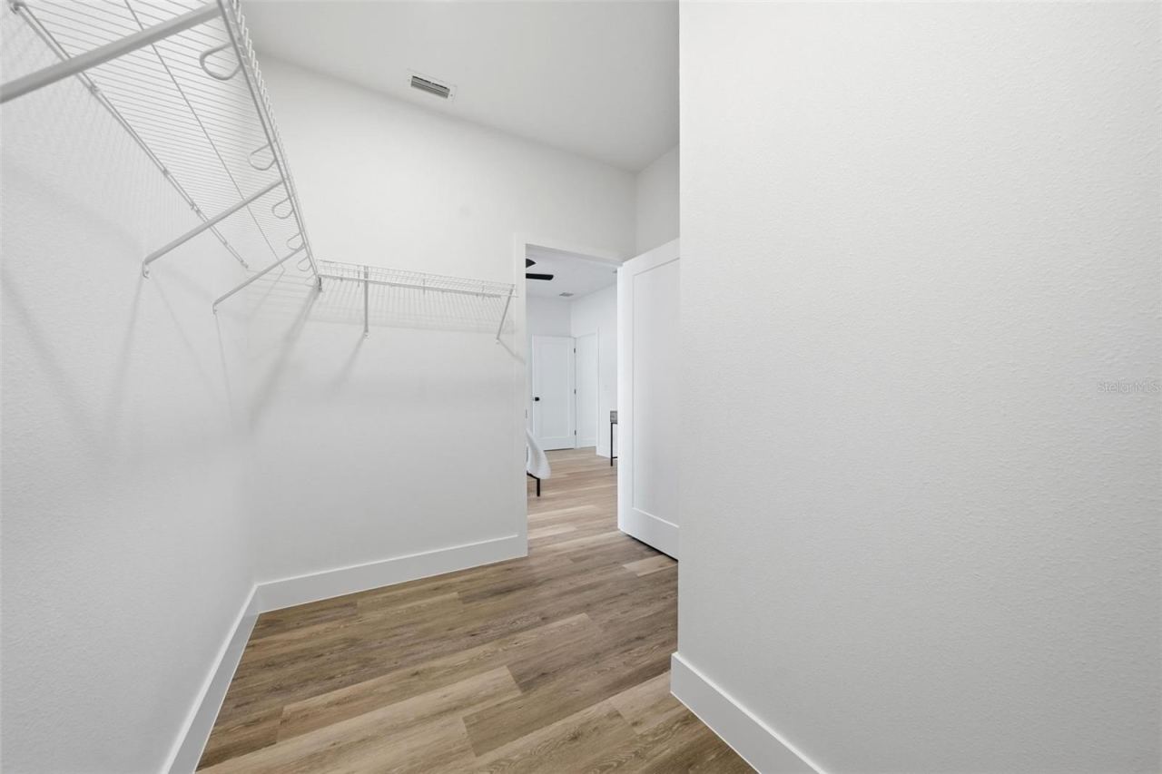 Photo 12 of 20: Primary Walk-In Closet
