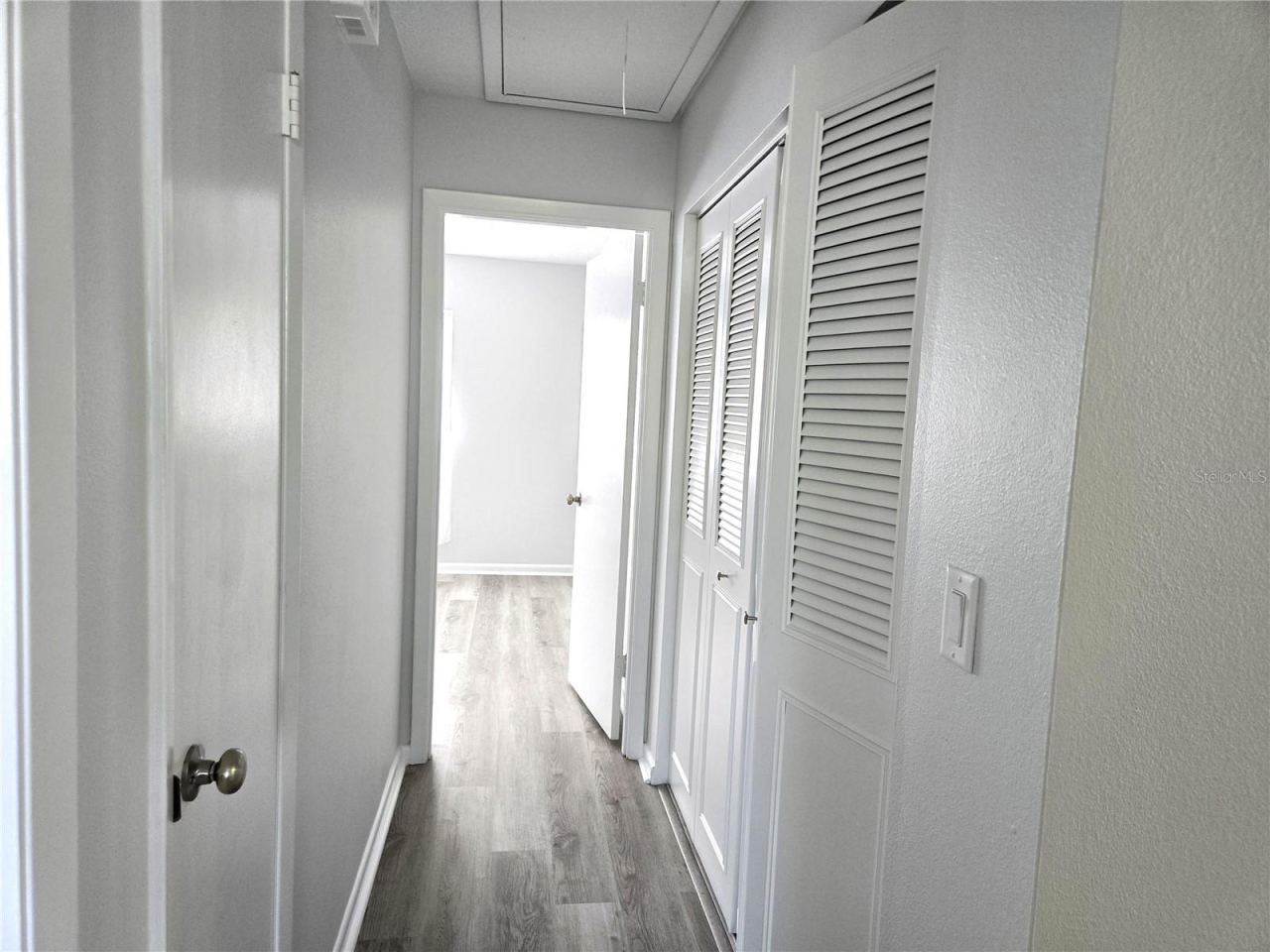 Photo 20 of 20: Hallway 2 closets leading to Primary Bedroom