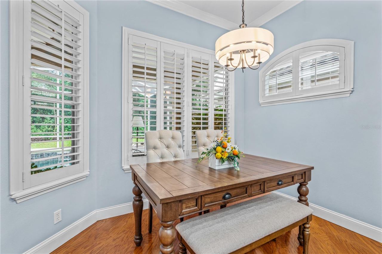 Photo 18 of 20: The eat-in kitchen offers large windows to enjoy the view out back toward the golf course