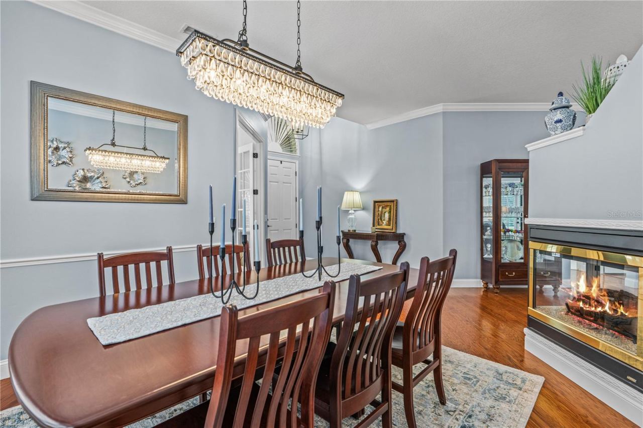 Photo 12 of 20: Gorgeous dining room light fixture coordinates with the chandelier in the den