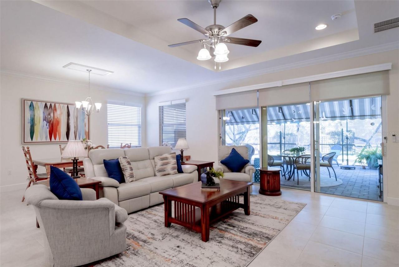 Photo 10 of 20: View of the Great Room, Dining Room & expanded screen enclosed covered Lanai