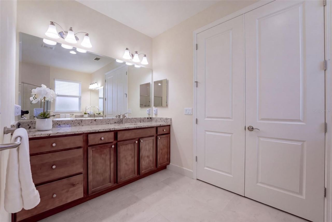 Photo 18 of 20: Primary Bathroom w/ double door entry into Bedroom