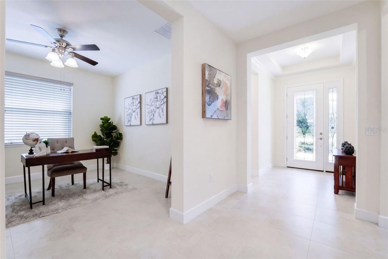 Photo 2 of 20: Foyer entryway w/ leaded glass door, sliding screen door, porcelain tile & a tray ceiling