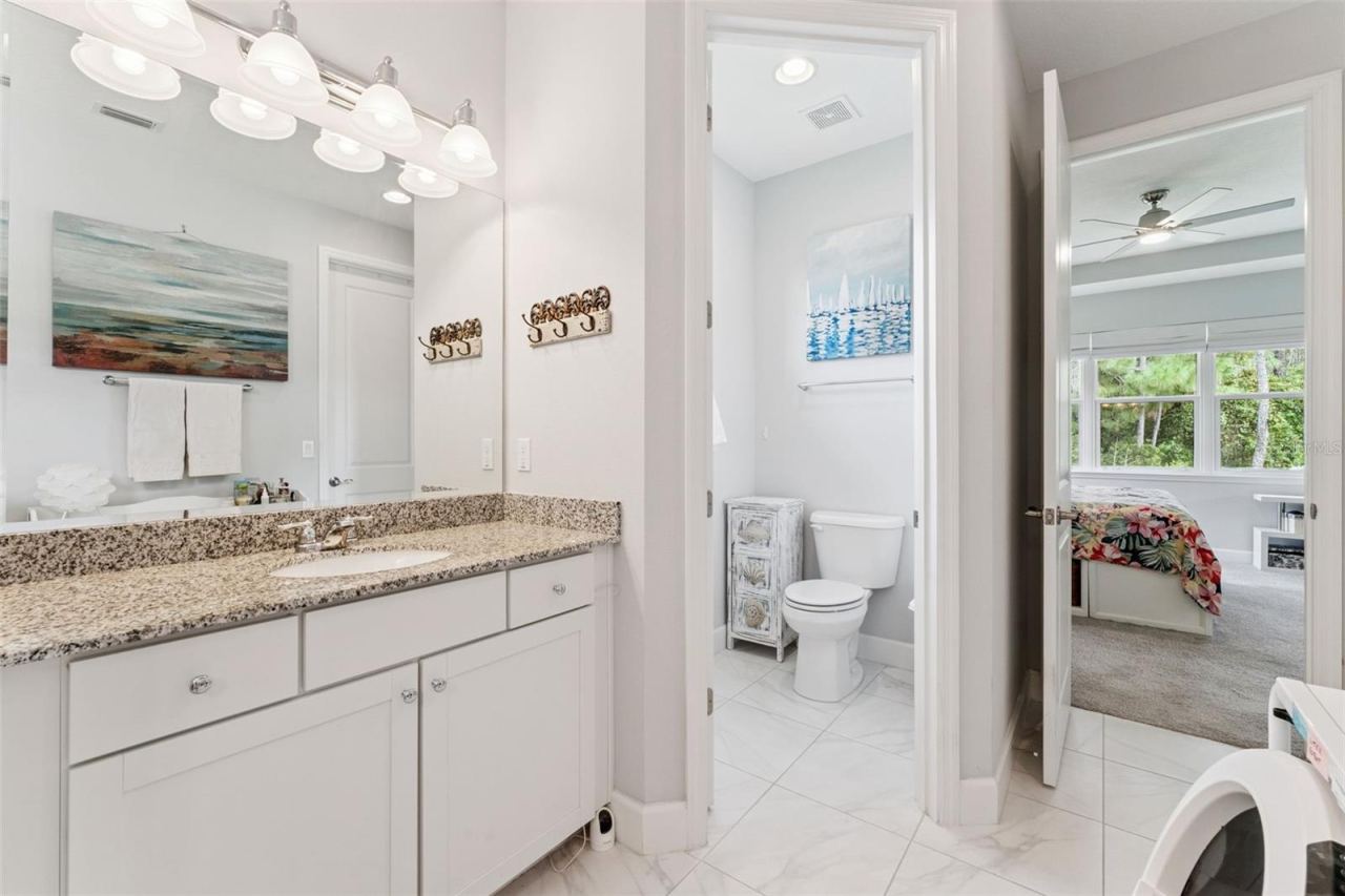 Photo 19 of 20: Primary Bathroom w/ door to bedroom