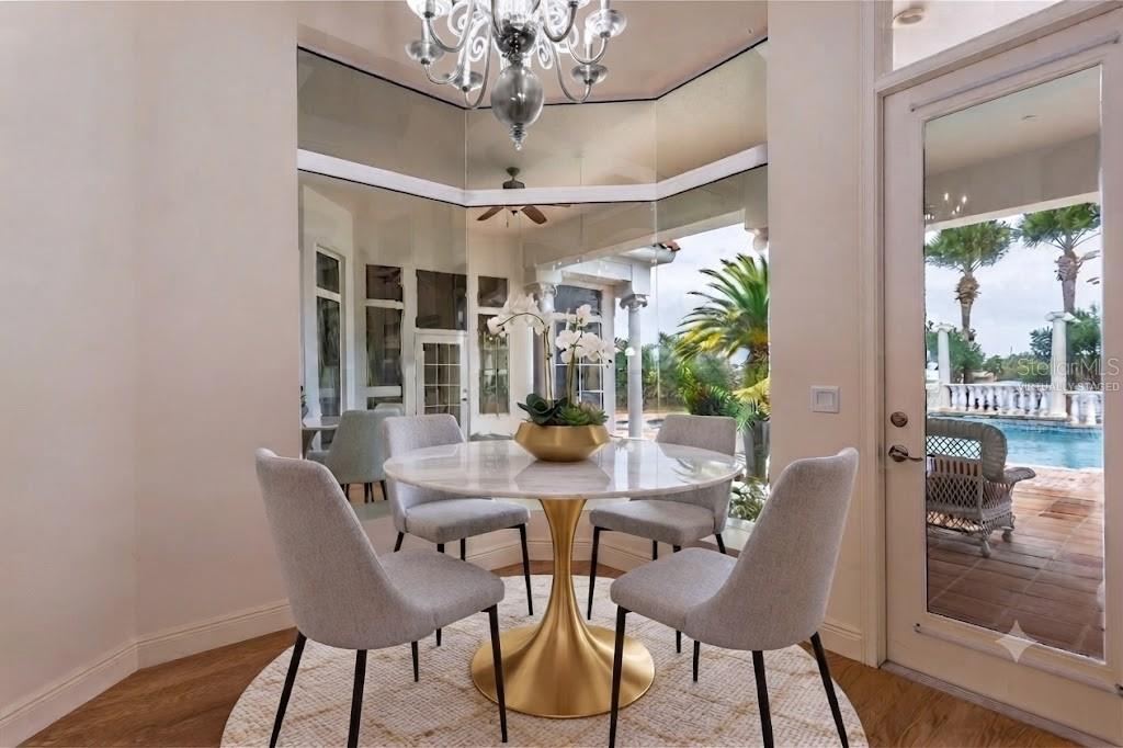 Photo 19 of 20: Virtually Staged Breakfast Nook Overlooks The Pool
