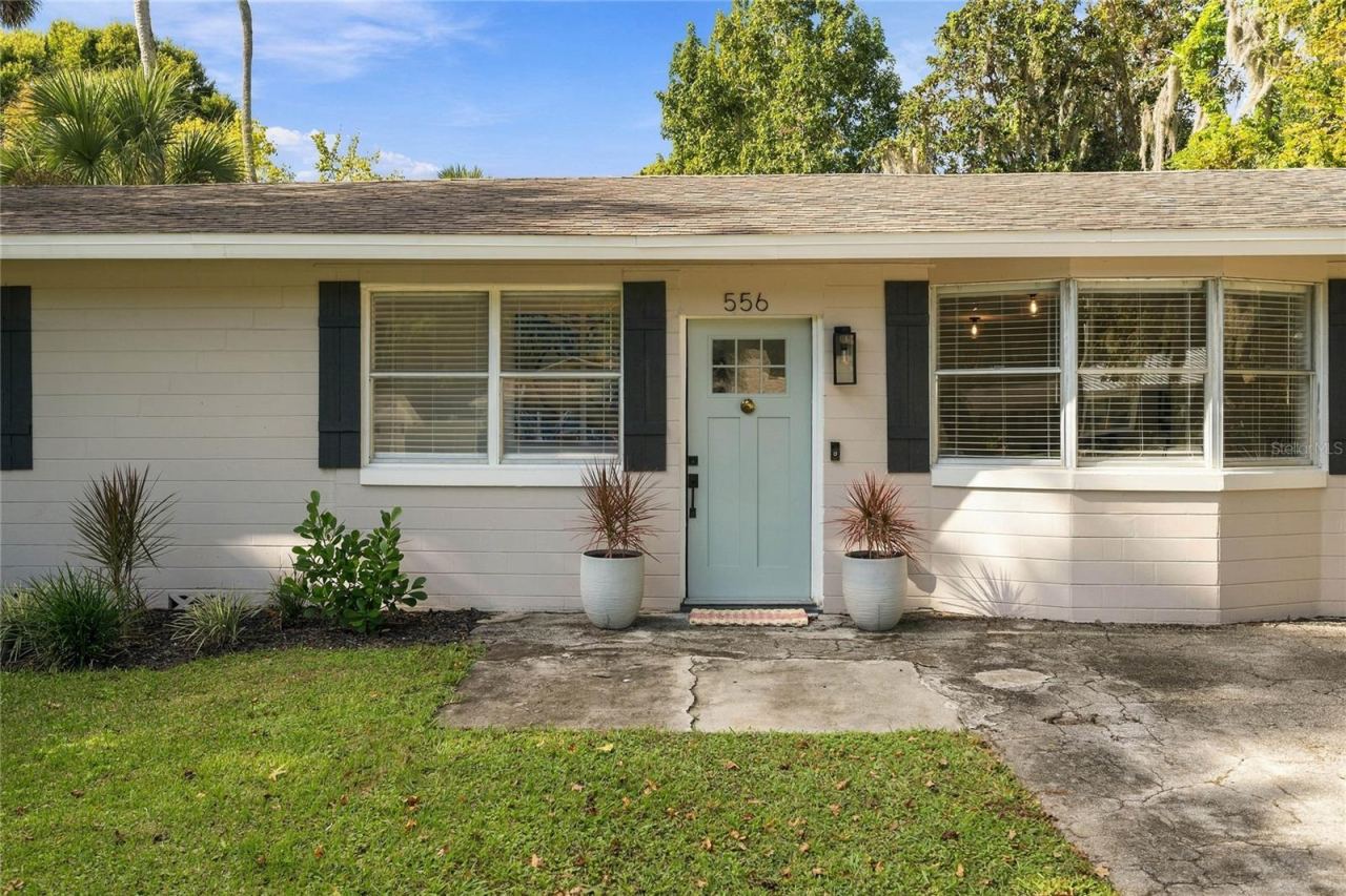 Photo 3 of 20: lovely landscaped front and pretty new door and sidelights